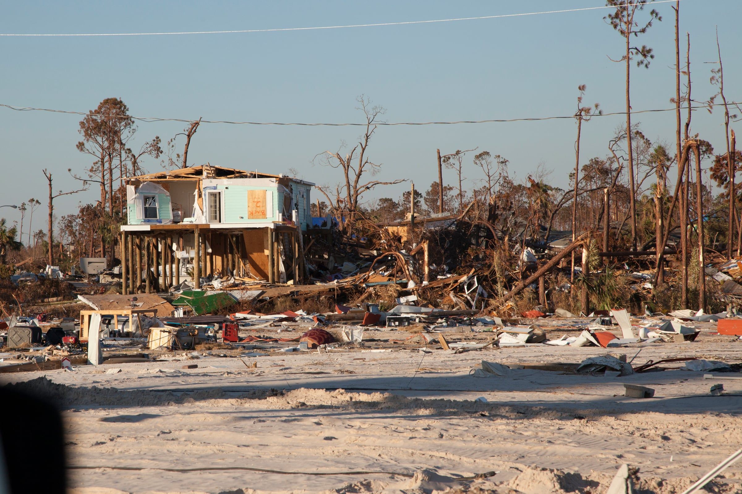 Destroyed beachfront homes and scattered debris along U.S. Route 98 in Mexico Beach, Florida, after Hurricane Michael in 2018